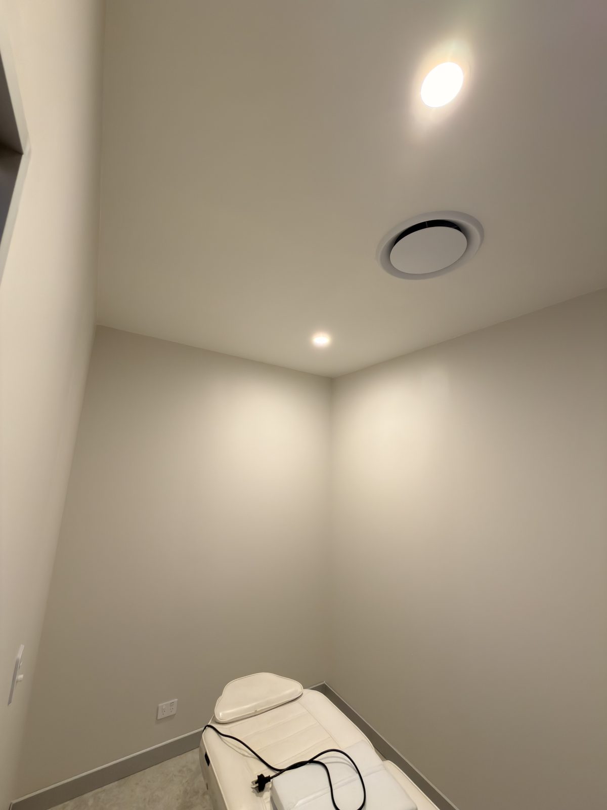 A completed treatment room with flush set ceiling and new partition walls