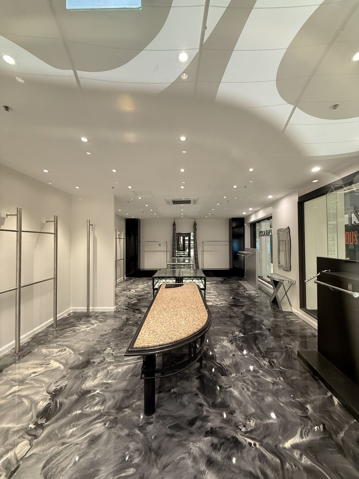 The completed Paparazzi interior with curved bulkhead ceiling and display lighting