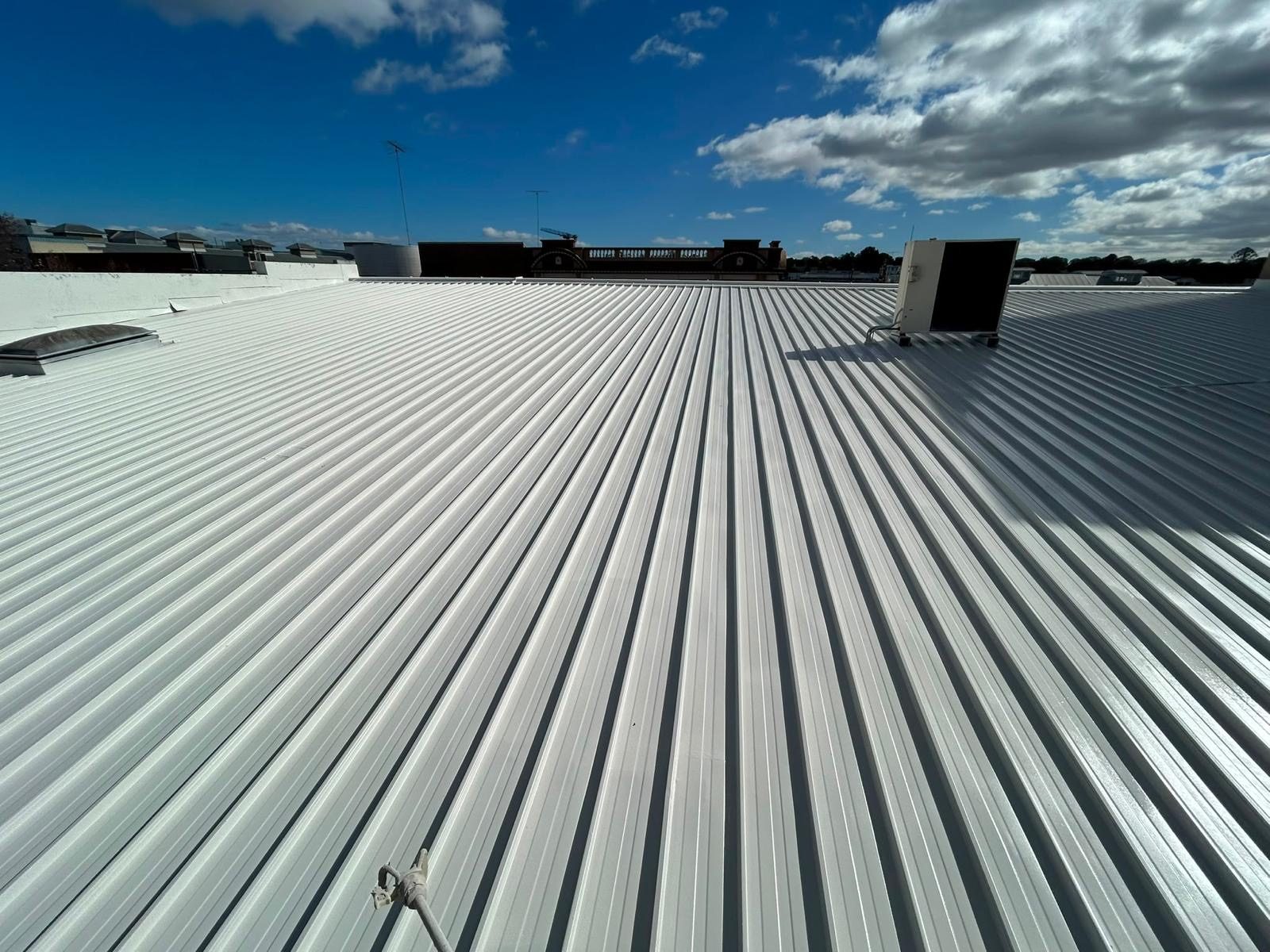 Completed roof membrane system over a commercial building